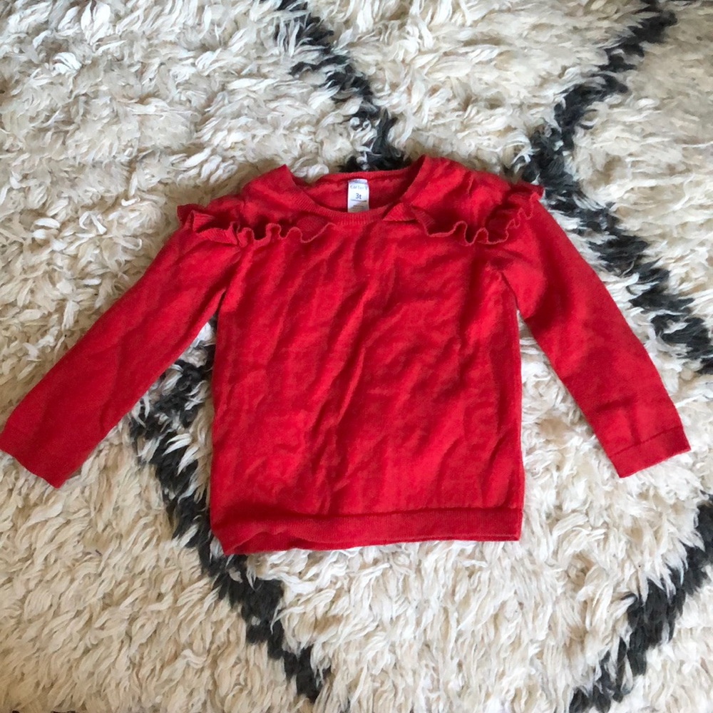 Red sweater with ruffle detail